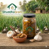shuddhogram-garlic-pickle-bottle-in-natural-background garlic-achar-made-with-wood-pressed-mustard-oil premium-quality-desi-rosuner-achar-by-shuddhogram pure-organic-garlic-pickle-in-bangladesh